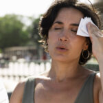 elder-woman-struggling-with-high-temperature-1-748x499